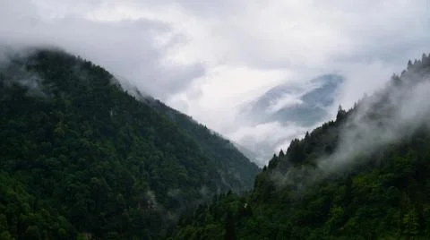 Beautiful mountains range under the clouds Stock Photos