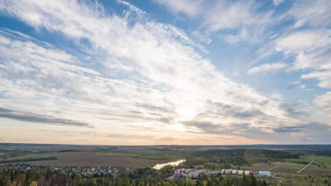 Beautiful movement of fluffy clouds with clear blue sky. The camera follows the Stock Footage 250584078