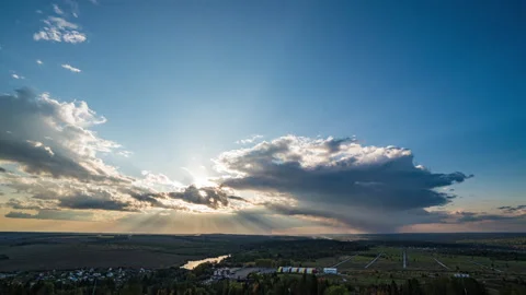 Beautiful movement of fluffy clouds with clear blue sky. Dramatic clouds at Stock Footage 250584351