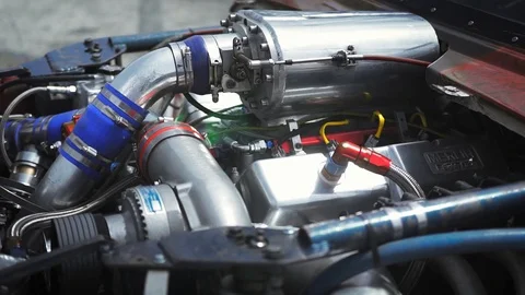 Beautiful movement, a powerful engine in an rebuild drag race car.	 Stock-Footage 108854050