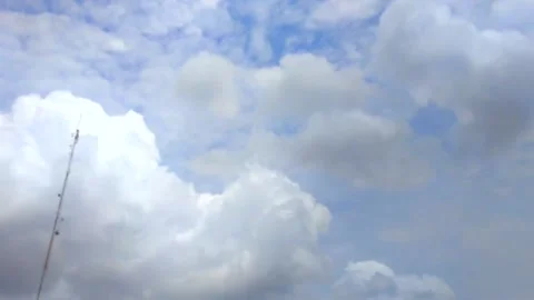 The beautiful movement of white clouds in the blue sky on a sunny day Stock Footage 220538054