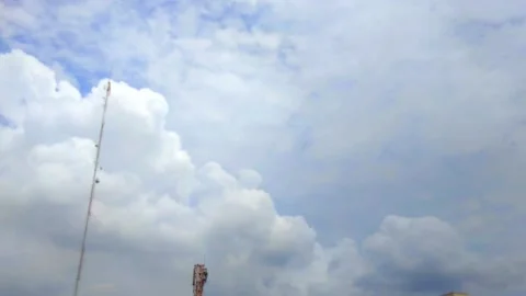 The beautiful movement of white clouds in the blue sky on a sunny day Stock Footage 220538078