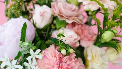 Beautiful multi colored bouquet on a pink background close-up. Stock Footage 201056001