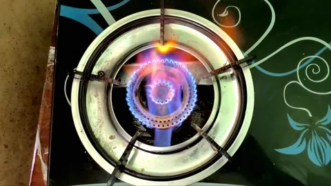 A beautiful multi-colored fire ignites with flames from gas, viewed from above. Stock Footage 332063406