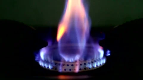 A beautiful multi-colored flame flares up and ignites Stock Footage 332062713