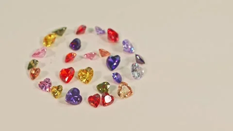 .Beautiful multi-colored heart-shaped gemstones set in a circle. Stock Footage 253094028