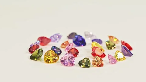 .Beautiful multi-colored heart-shaped gemstones set in a circle. Stock Footage 253094079