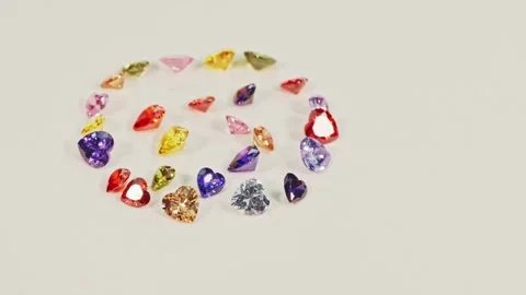 .Beautiful multi-colored heart-shaped gemstones set in a circle. Stock Footage 255301380