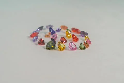 .Beautiful multi-colored heart-shaped diamonds set in a circle. Stock Photos