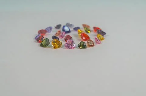 .Beautiful multi-colored heart-shaped diamonds set in a circle. Stock Photos