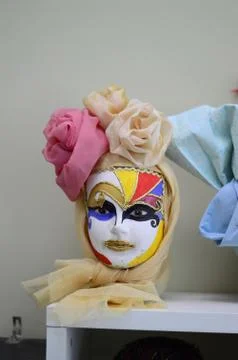Beautiful multi-colored wigs stand on a shelf 写真素材