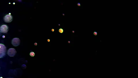 Beautiful multi-coloured circle particles over black background. Stock Footage 172428314