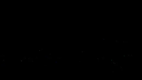 Beautiful multi-coloured particles flying over black background Stock-Footage 203300726