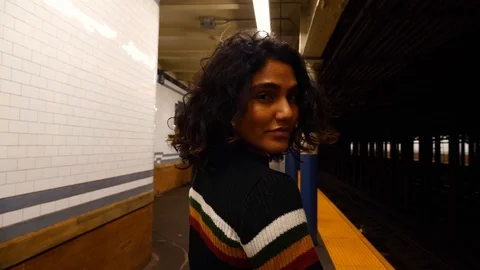 Beautiful multi-ethnic hispanic millennial female in New York City subway metro  Stock Footage 122532379