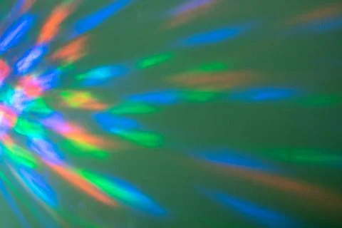 Beautiful multicolored geometric patterns pink blue yellow on a green backgro Stock Photos