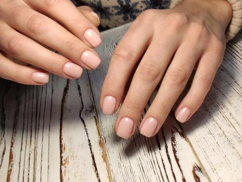 Beautiful nail design on female hands on background. Stock Photos