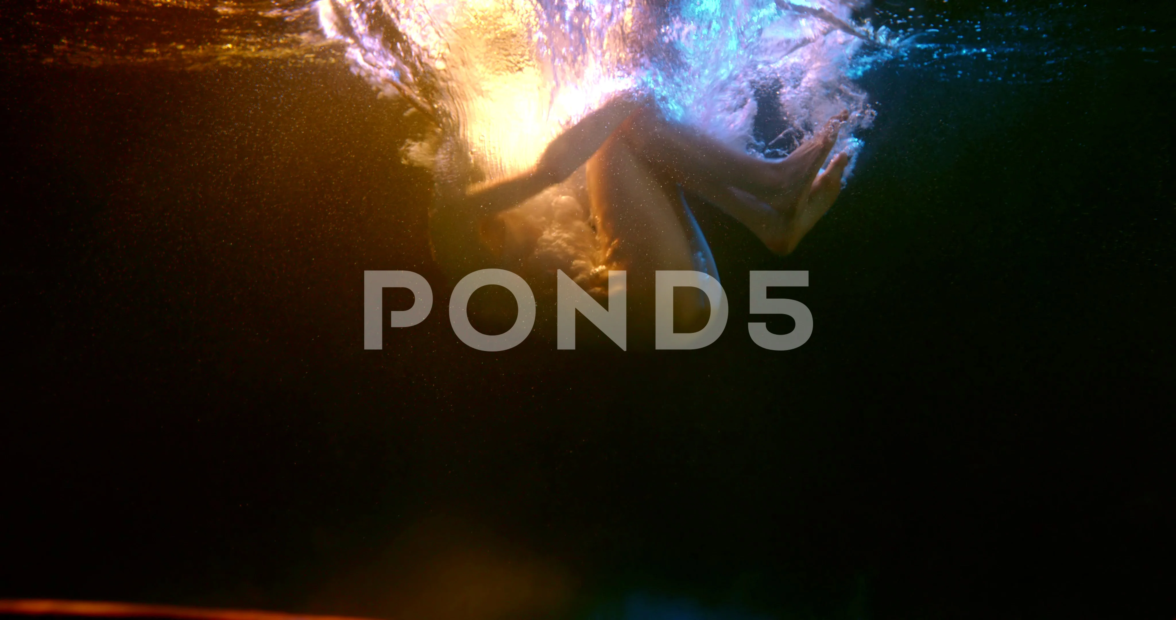 beautiful naked woman is falling on bottom of pool, underwater view, in  fetal