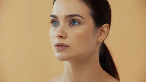 Beautiful naked woman smiling at camera | Stock Video | Pond5