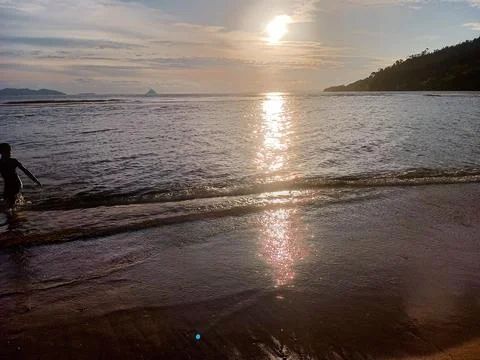 Beautiful natural scenery of the beach at dusk Stock Photos
