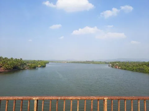 Beautiful natural scenery of river in goa tropical green forest with mountains. Stock Photos