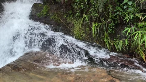 Beautiful natural waterfall cascading down rocky cliffs Stock-Footage 344142707