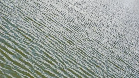 Beautiful natural wave pattern of water with reflection of bright sun light.. Stock Photos