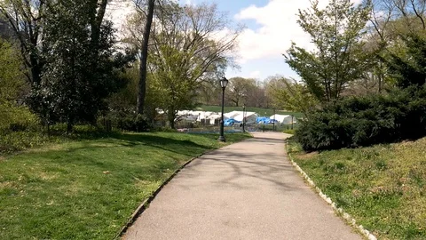 Beautiful Nature Path Leads To Grim Central Park Coronavirus Field Hospital Stock Footage 128661680