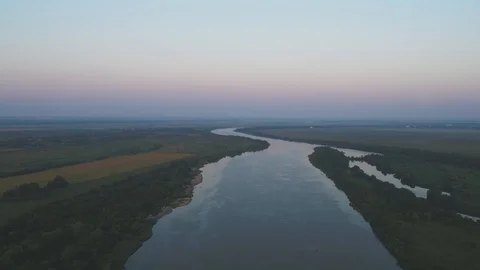 Beautiful nature: river on the plain, evening sky, shooting from a height Video stock 117864065