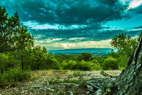 Beautiful nature of Spain. A hill overlooking city. mountains and cloudy sky Stock Photos