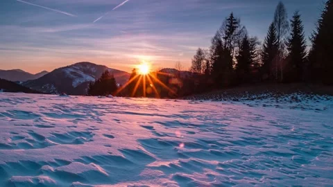 Beautiful nature sunset over forest and snow structure in cold winter Time lapse Stock Footage 150435575