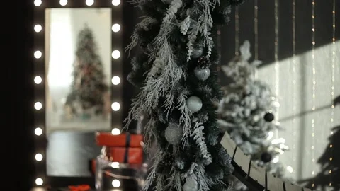 Beautiful New Year's interior, branches of a Christmas tree close-up. Stock Footage 205936026