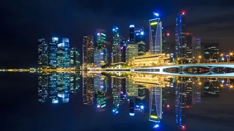 Beautiful Night Cityscape and Reflection On Water Of Singapore 4K Time lapse Stock Footage 86243678