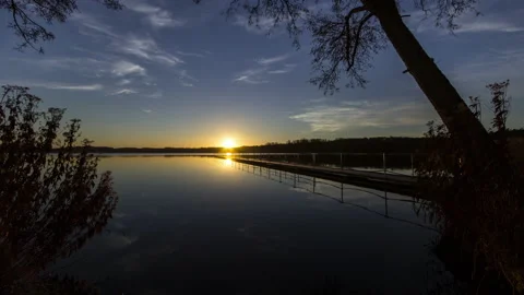 Beautiful Night to Day Sunrise lake view and tree timelapse Stock Footage