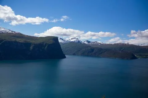 Beautiful Norwegian fjord during the summer, blue water, mountains. Stock Photos