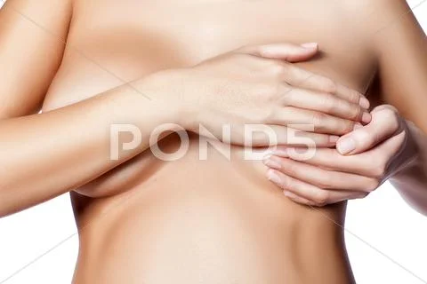 Beautiful nude pregnant woman covering her breasts with beautiful skin, close up Stock Photos