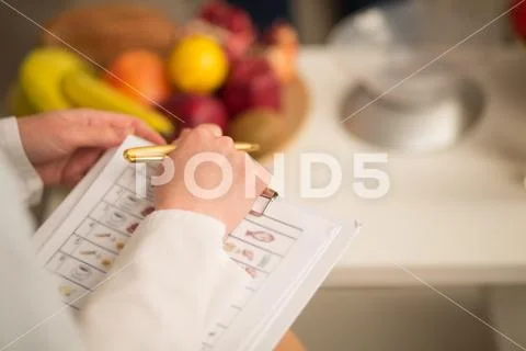 A beautiful nutritionist consult at the office Stock Photos