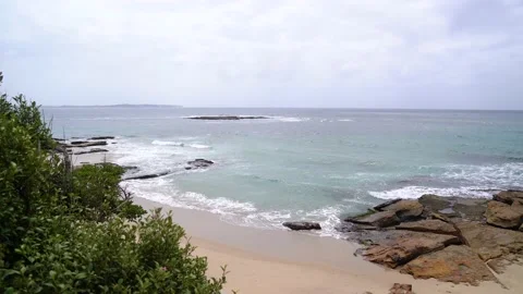 Beautiful ocean beach under grey sky Stock Footage 130368853