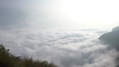 Beautiful ocean of clouds and mountain peaks above clouds. Stock Footage 149264187