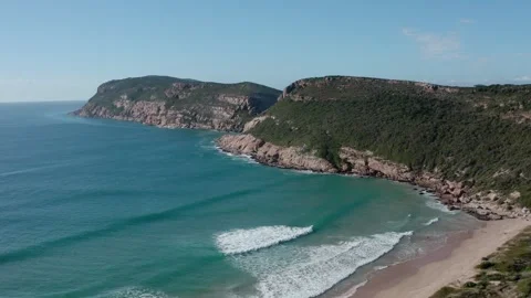 Beautiful ocean dramatic headland with crytsal clear water aerial Video stock 329105102