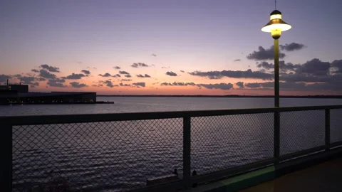 Beautiful Ocean scene with sun set at twilight Stock Footage 140996063