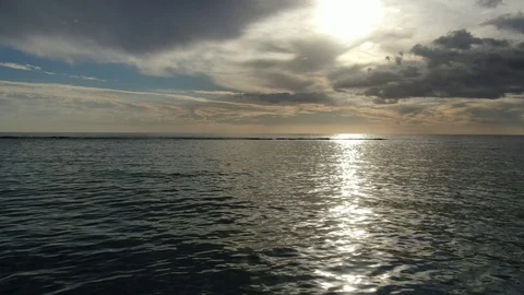 Beautiful ocean sunset discovering camera moving forward Video stock 120426633
