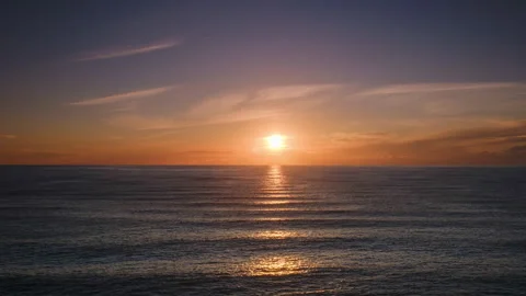 Beautiful ocean sunset timelapse with sun reflecting on water Stock Footage 336370770