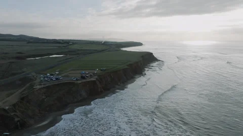 A beautiful ocean view with a cliff in the background Stock Footage 298251503