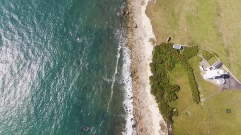 A beautiful ocean view with a house in the background Stock Footage 297950489