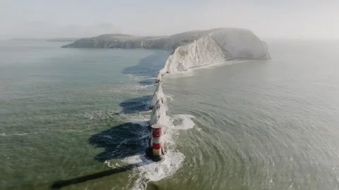 A beautiful ocean view with a lighthouse in the middle Stock Footage 297078642