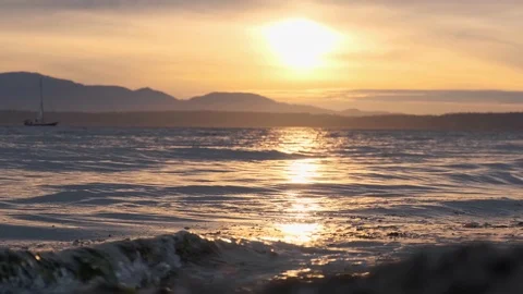 Beautiful ocean view at sunset in slow motion with sailboat Stock Footage 111850573
