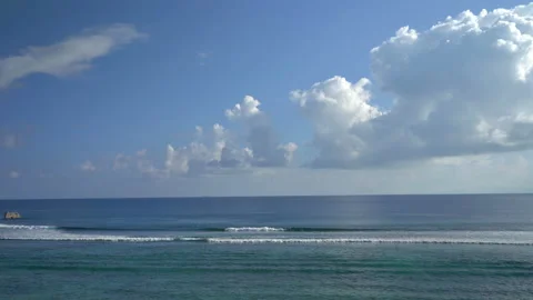 Beautiful ocean view with white clouds shot from high ground Stock Footage 111361599