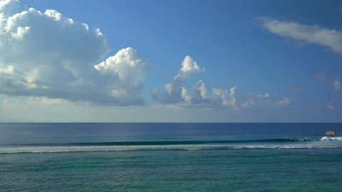 Beautiful ocean view with white clouds shot from high ground Stock Footage 111361697