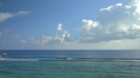 Beautiful ocean view with white clouds shot from high ground Stock Footage 111361879