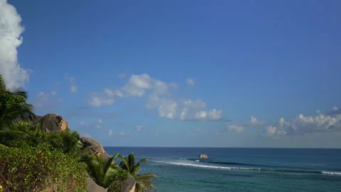 Beautiful ocean view with white clouds shot from high ground Video stock 111362172